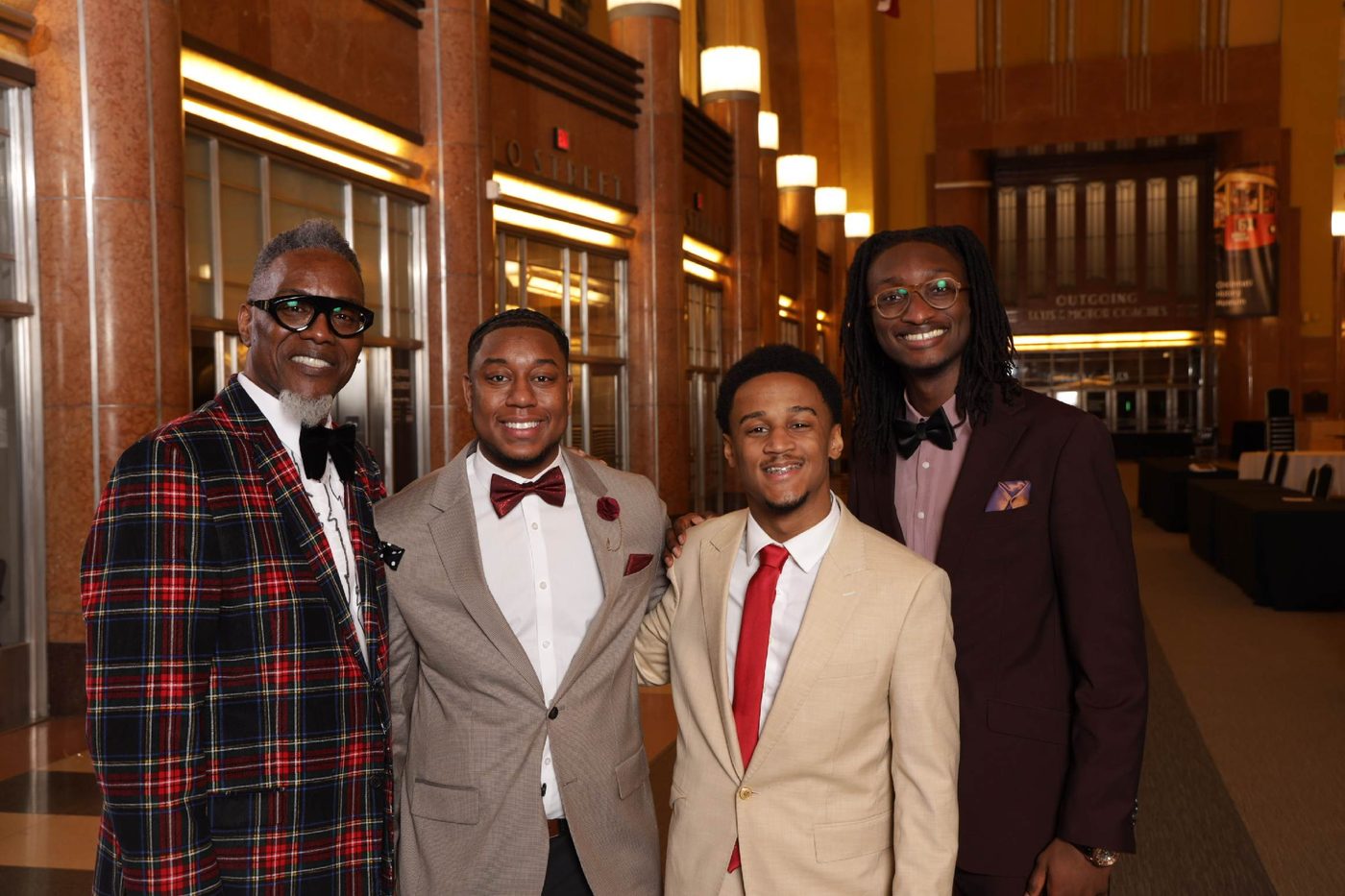 Yohan with three others in formal wear at the Antonio Johnson Scholarship Gala, held at Cincinnati Union Terminal