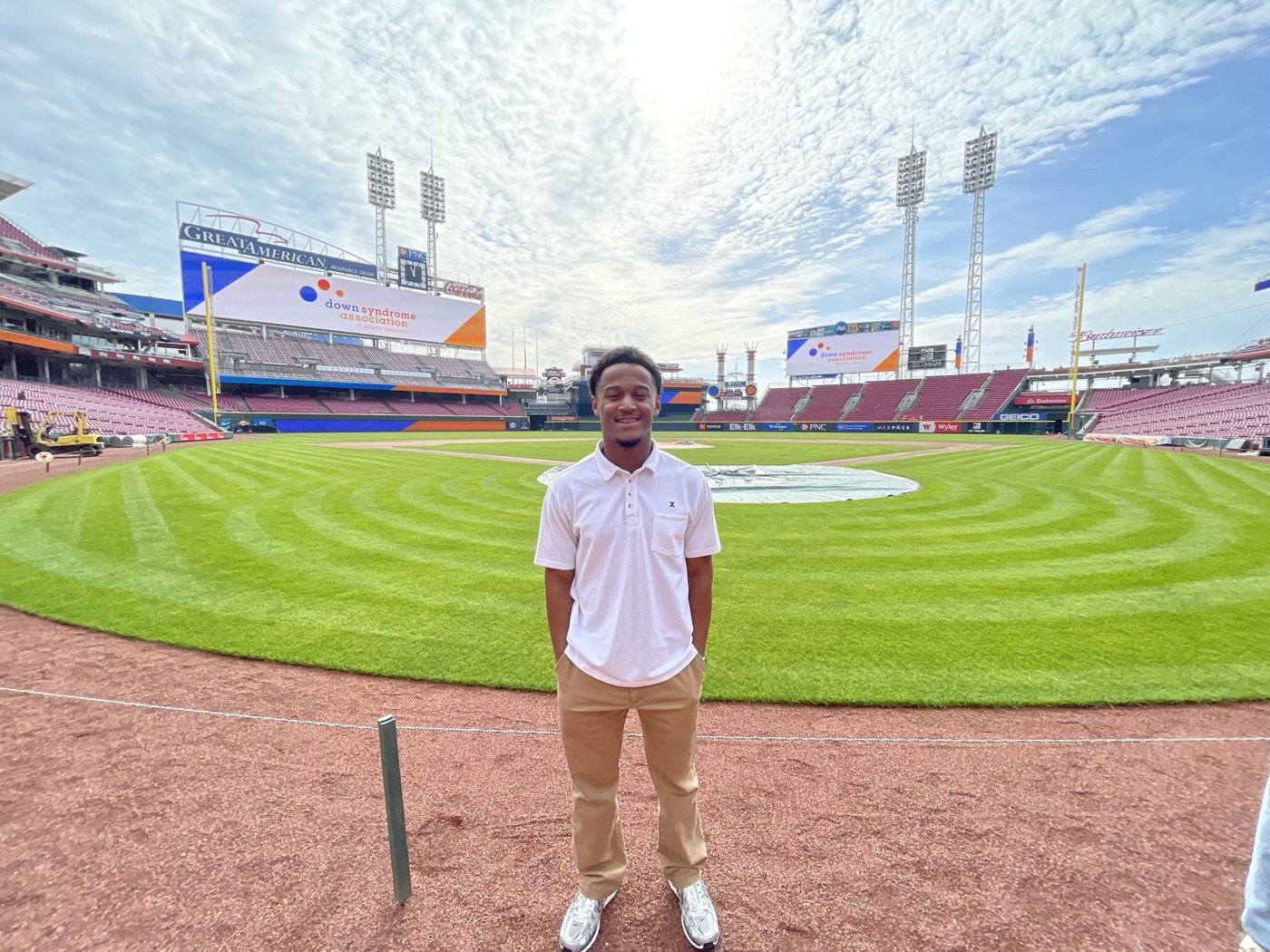 Yohan standing on the warning track at Great American Ball Park in front of the outfield